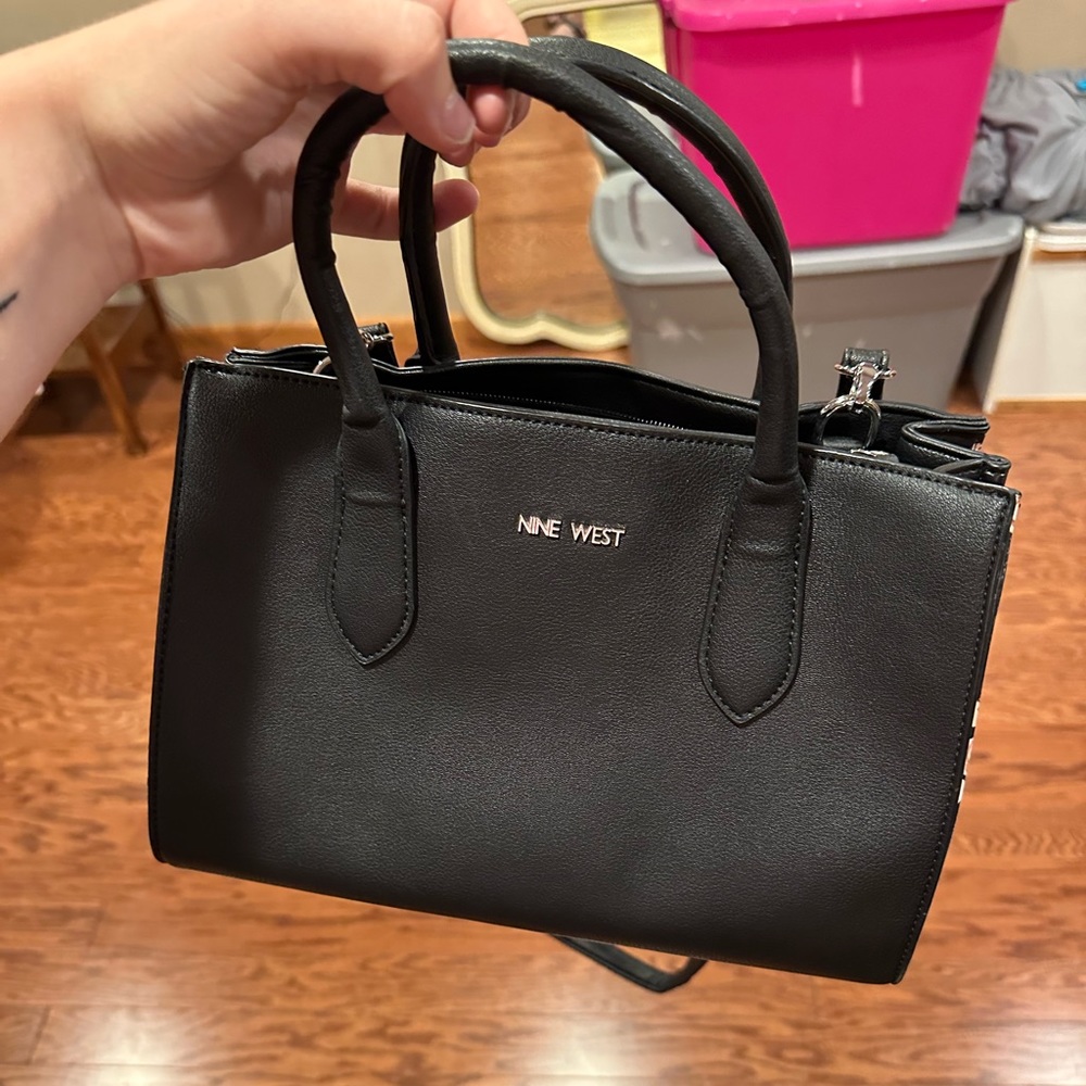 This a Nine West purse. I purchased it for $55. It’s been used about five times.
